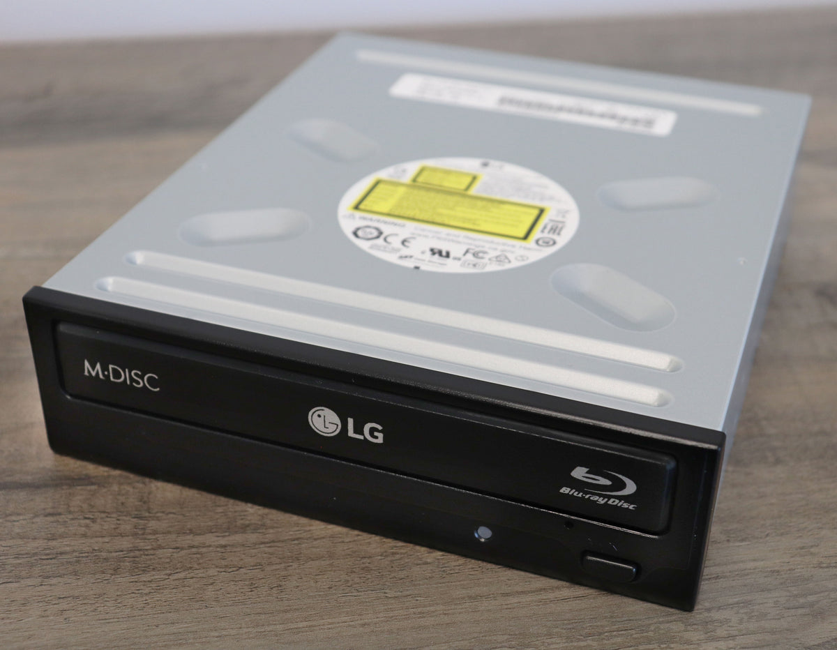 LG Blu-ray disc drive on a wooden surface